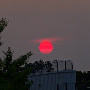 Red moon in a hazy sky
