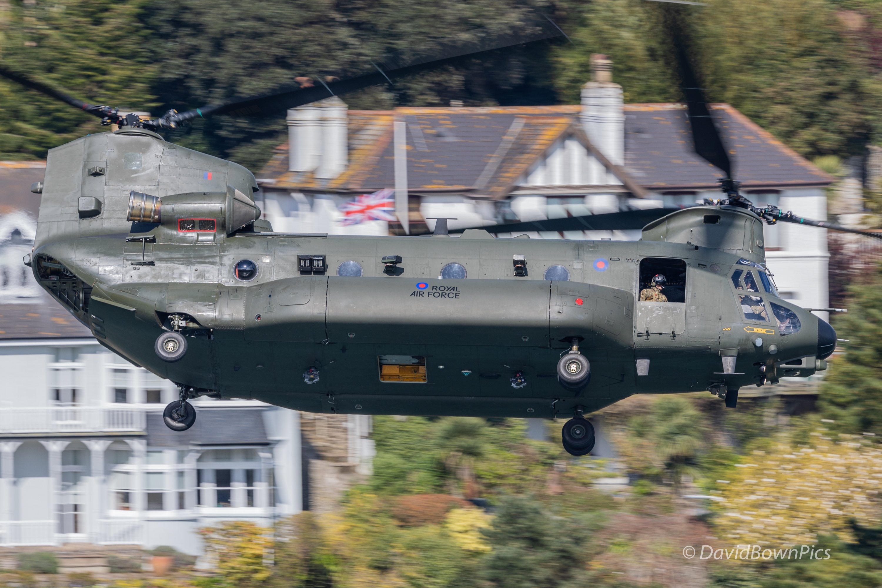 RAF Chinook ZH901 flying past Union Jack at half mast