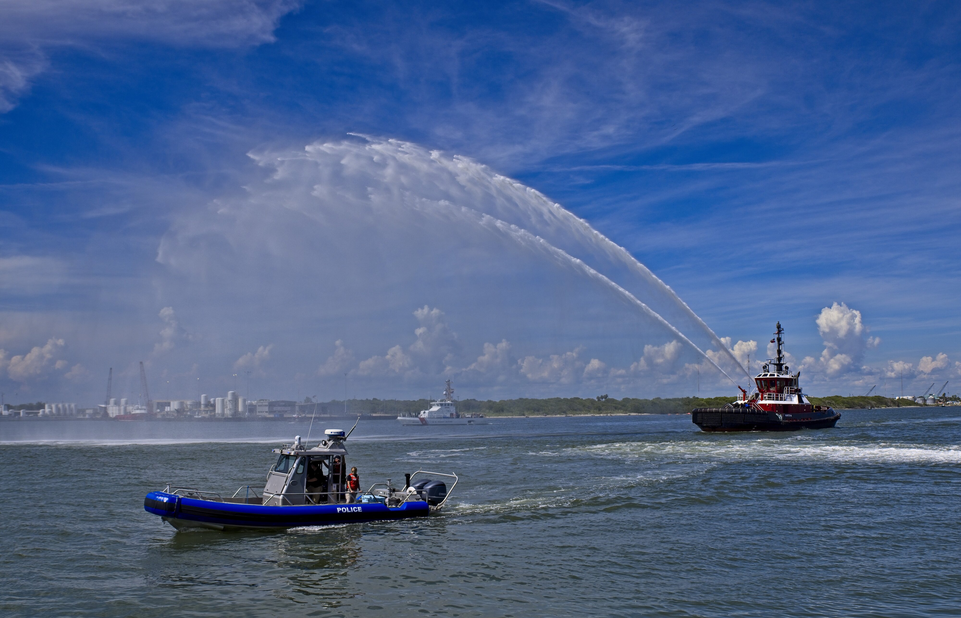 tug spraying water  ahead of the USS Texas BB-35